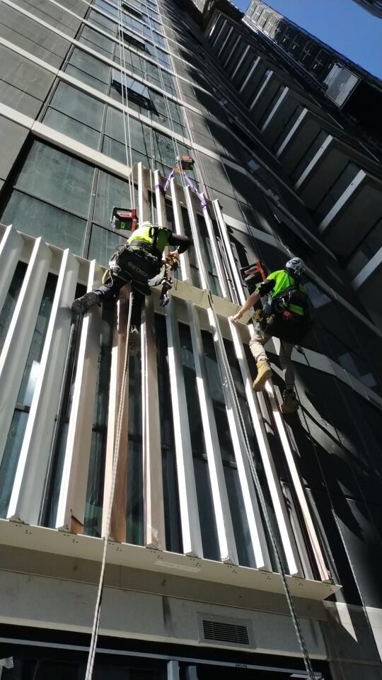 Architectural aluminium ribbon façade element installation at 66 Hope Street